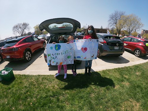 Children with Earth Day posters