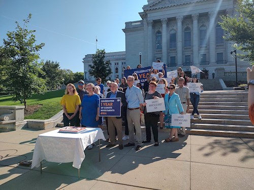 group standing in front of the capitol building