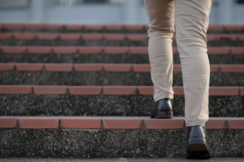 person walking up steps