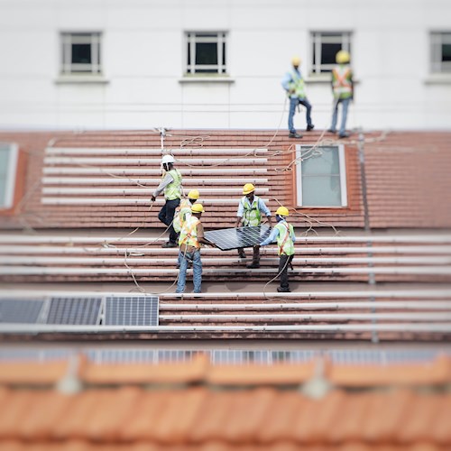Team installing solar panel