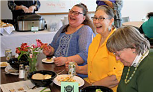 Women enjoying a lunch at Badger Prairie Needs Network